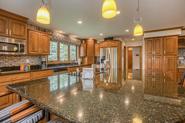 800 Ridge Ave, Platteville, WI 53818 - kitchen with stainless steel appliances, brown cabinetry, backsplash, and recessed lighting