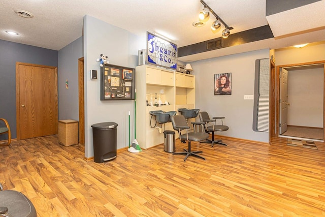 800 Ridge Ave, Platteville, WI 53818 - office area featuring light wood finished floors, a textured ceiling, a dry bar, and baseboards