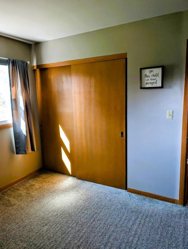 3434 Kentucky St, Racine, WI 53405 - unfurnished bedroom featuring carpet floors, a closet, and baseboards