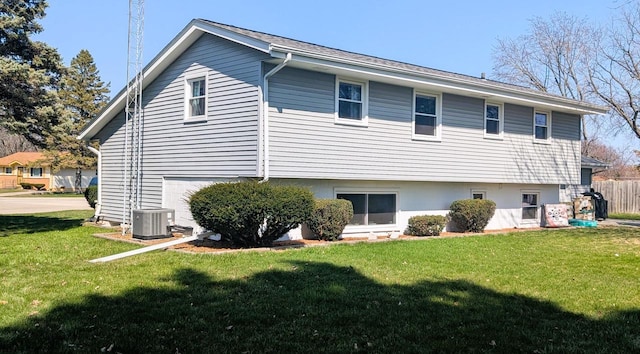 3434 Kentucky St, Racine, WI 53405 - back of property with central AC unit, a yard, and a garage