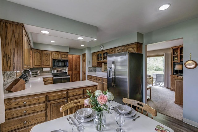 4034 Chicory Rd, Mount Pleasant, WI 53403 - kitchen featuring appliances with stainless steel finishes, brown cabinets, light countertops, backsplash, and recessed lighting