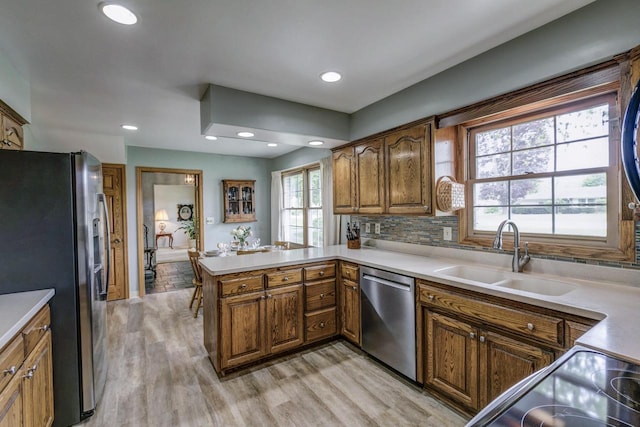4034 Chicory Rd, Mount Pleasant, WI 53403 - kitchen featuring stainless steel appliances, a sink, a peninsula, light wood-style flooring, and recessed lighting