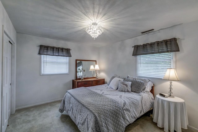 4034 Chicory Rd, Mount Pleasant, WI 53403 - carpeted bedroom with a chandelier, baseboards, and a closet