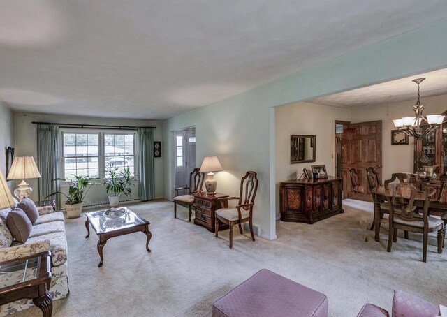4034 Chicory Rd, Mount Pleasant, WI 53403 - living area with a chandelier and light colored carpet