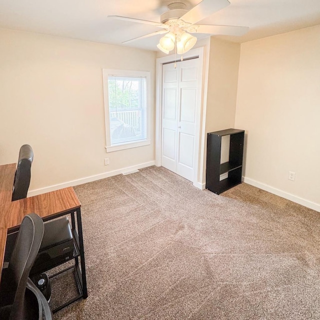 509 E Jefferson St, Stoughton, WI 53589 - unfurnished office featuring a ceiling fan, baseboards, and carpet flooring