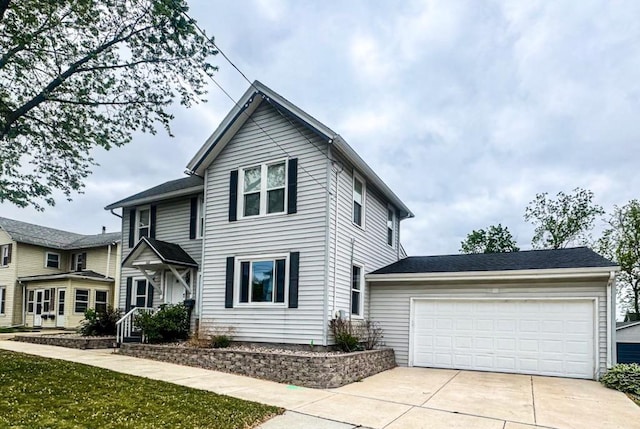 509 E Jefferson St, Stoughton, WI 53589 - traditional-style house with concrete driveway and an attached garage