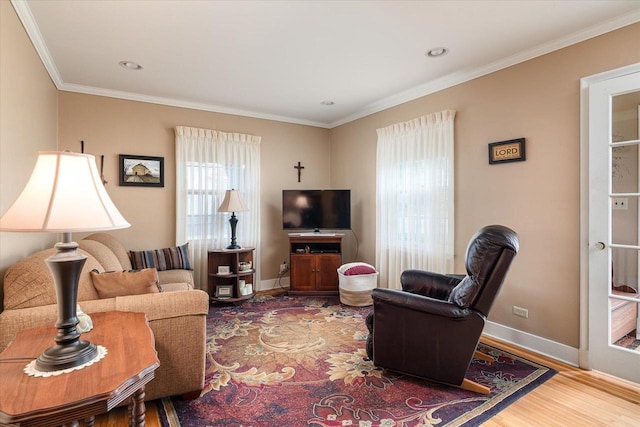 403 N Rock Ave, Viroqua, WI 54665 - living area with wood finished floors, crown molding, baseboards, and recessed lighting