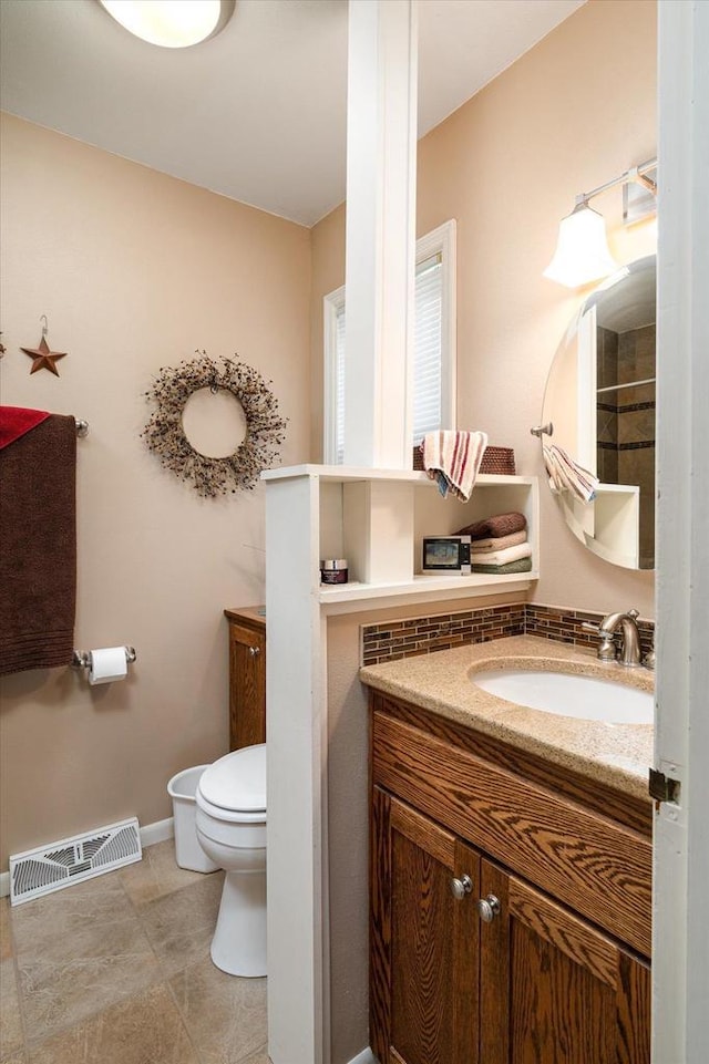 403 N Rock Ave, Viroqua, WI 54665 - bathroom with vanity, toilet, baseboards, and tile patterned floors