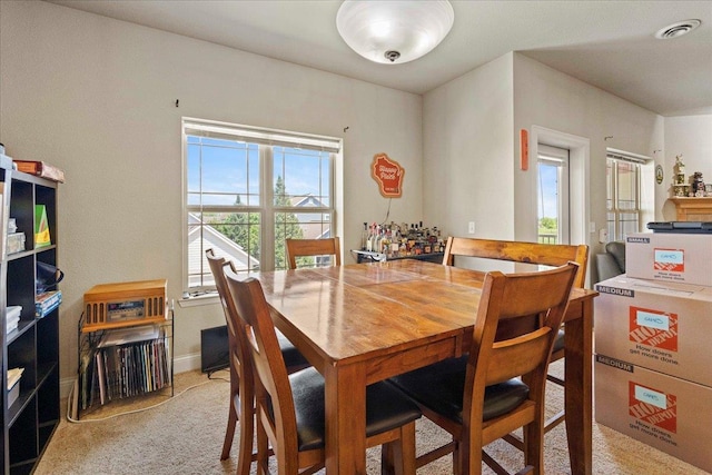1300 School St Unit 209, Sun Prairie, WI 53590 - dining space featuring light colored carpet