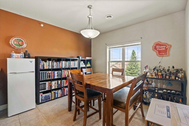 1300 School St Unit 209, Sun Prairie, WI 53590 - dining room with light tile patterned floors