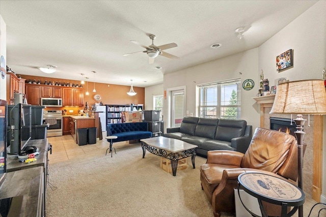 1300 School St Unit 209, Sun Prairie, WI 53590 - living room featuring ceiling fan, a lit fireplace, and light carpet