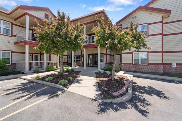 1300 School St Unit 209, Sun Prairie, WI 53590 - view of building exterior featuring uncovered parking