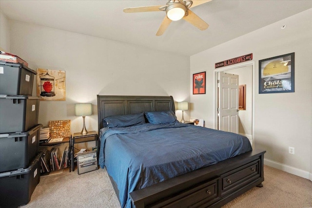 1300 School St Unit 209, Sun Prairie, WI 53590 - bedroom with light colored carpet, baseboards, and ceiling fan