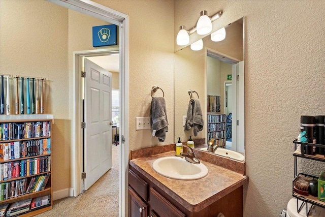 1300 School St Unit 209, Sun Prairie, WI 53590 - bathroom featuring vanity and a textured wall