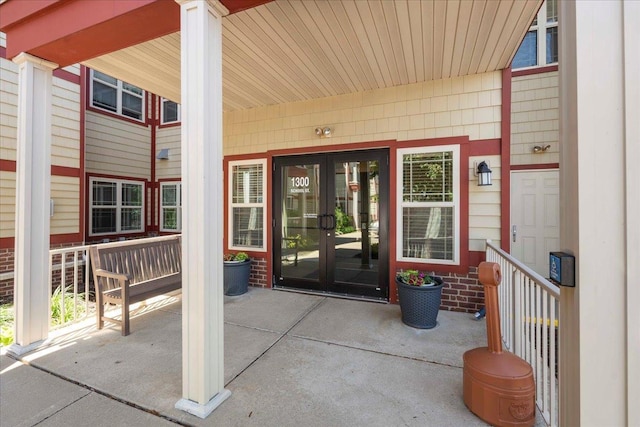 1300 School St Unit 209, Sun Prairie, WI 53590 - doorway to property featuring french doors and a porch