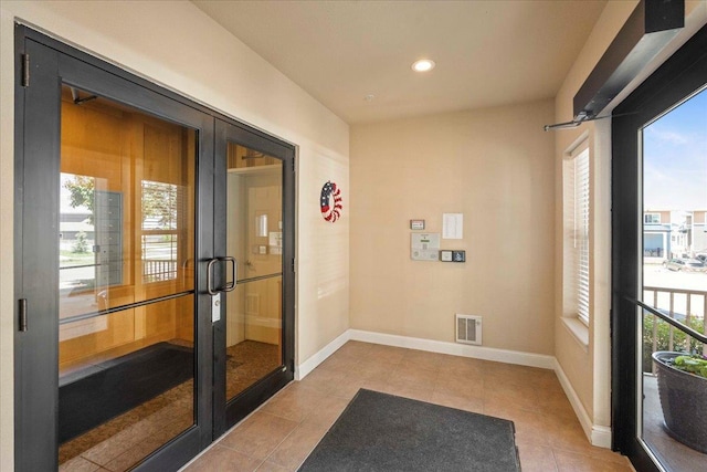 1300 School St Unit 209, Sun Prairie, WI 53590 - sunroom / solarium with french doors and healthy amount of natural light