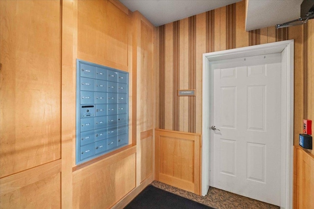 1300 School St Unit 209, Sun Prairie, WI 53590 - doorway to outside featuring mail area and wallpapered walls