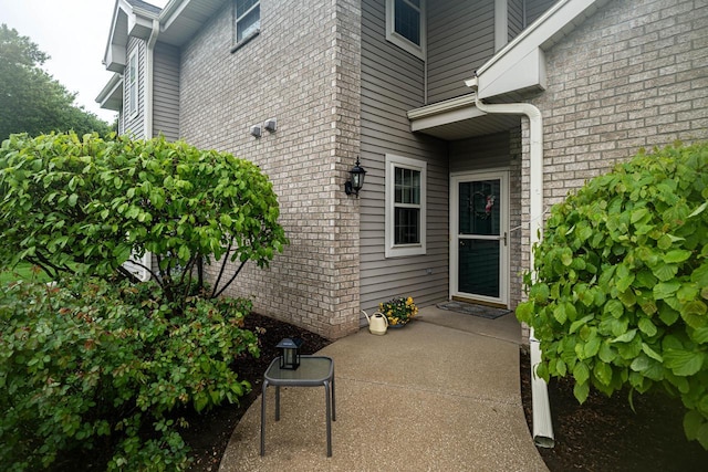 18625 Emerald Cir Unit A, Brookfield, WI 53045 - doorway to property featuring brick siding