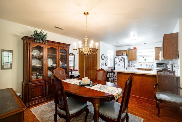 18625 Emerald Cir Unit A, Brookfield, WI 53045 - dining area featuring a chandelier and wood finished floors
