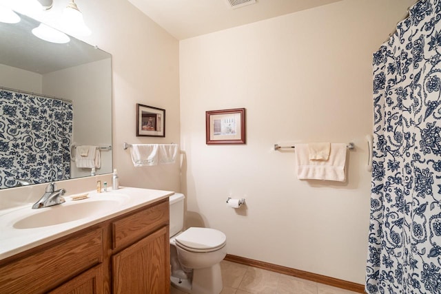 18625 Emerald Cir Unit A, Brookfield, WI 53045 - bathroom featuring vanity, toilet, tile patterned flooring, baseboards, and curtained shower