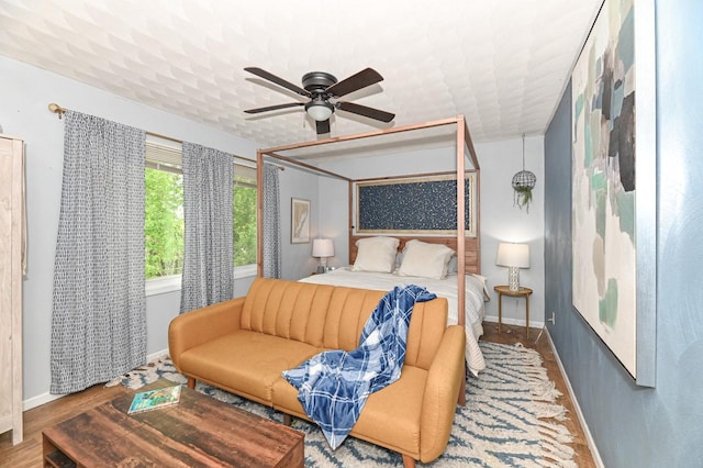1081 E Elm Rd, Oak Creek, WI 53154 - bedroom with baseboards, a ceiling fan, and wood finished floors
