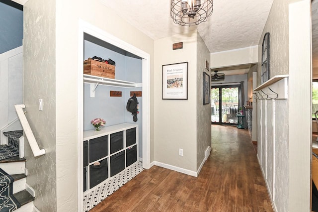 1081 E Elm Rd, Oak Creek, WI 53154 - hall featuring dark wood finished floors, a chandelier, baseboards, and stairs