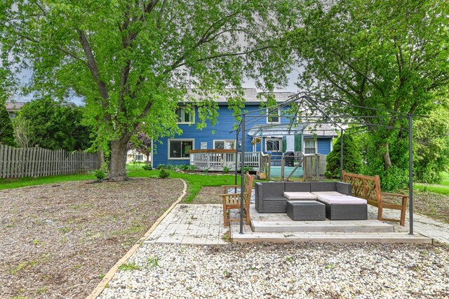 1081 E Elm Rd, Oak Creek, WI 53154 - rear view of house with a deck, an outdoor living space, and a patio