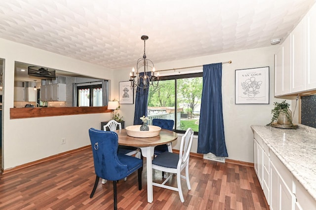 1081 E Elm Rd, Oak Creek, WI 53154 - dining space featuring a chandelier, wood finished floors, and baseboards