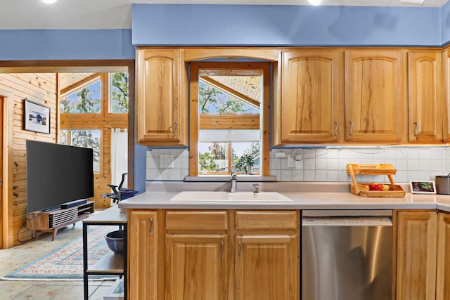 202 Lake St, Mount Horeb, WI 53572 - kitchen featuring dishwasher, a sink, backsplash, and light countertops