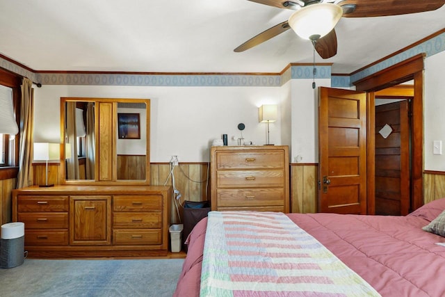 202 Lake St, Mount Horeb, WI 53572 - bedroom with a wainscoted wall, wooden walls, and ornamental molding