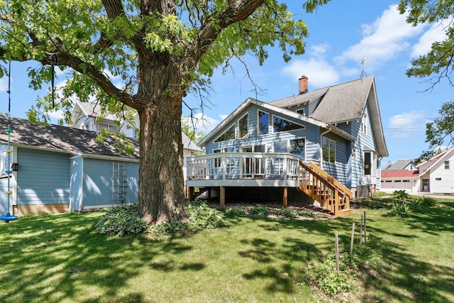 202 Lake St, Mount Horeb, WI 53572 - back of property with a wooden deck, a lawn, a chimney, and stairs