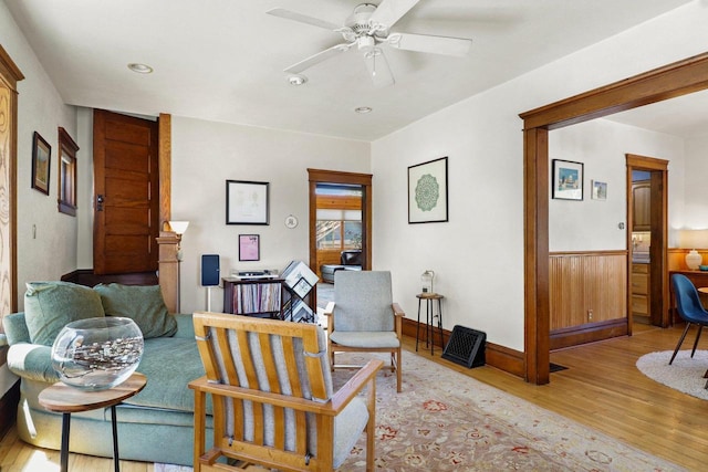 202 Lake St, Mount Horeb, WI 53572 - living area with wood finished floors, a ceiling fan, baseboards, recessed lighting, and wainscoting