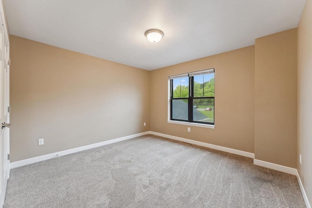 1512 Lake St, Baraboo, WI 53913 - carpeted empty room featuring baseboards