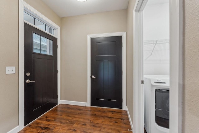 1512 Lake St, Baraboo, WI 53913 - entryway featuring washer / clothes dryer, baseboards, and wood finished floors