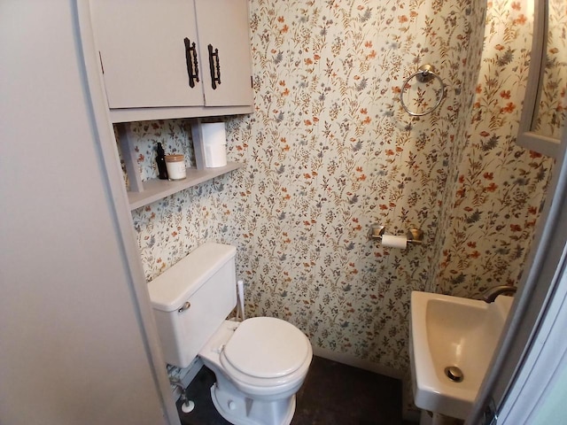 206 W Winnebago St, Appleton, WI 54911 - bathroom with toilet, wallpapered walls, and a sink