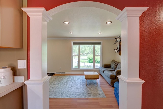 1621 W Crystal Dr, Edgerton, WI 53534 - living room featuring ornate columns, light wood-type flooring, crown molding, and recessed lighting