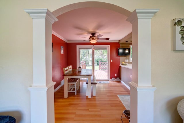 1621 W Crystal Dr, Edgerton, WI 53534 - dining space with arched walkways, decorative columns, and crown molding