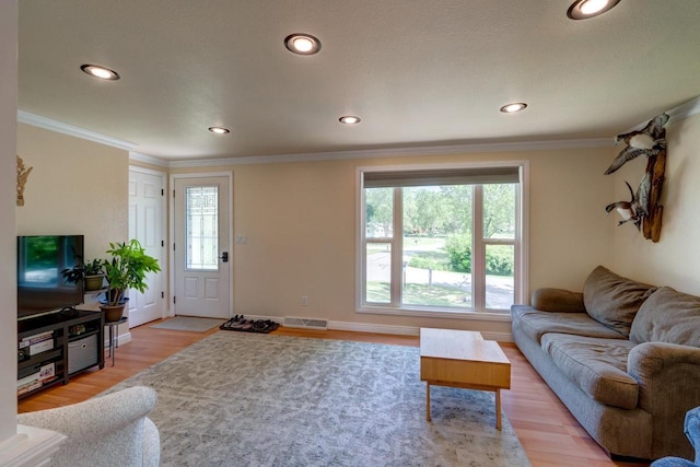 1621 W Crystal Dr, Edgerton, WI 53534 - living room with light wood-style flooring, recessed lighting, and crown molding