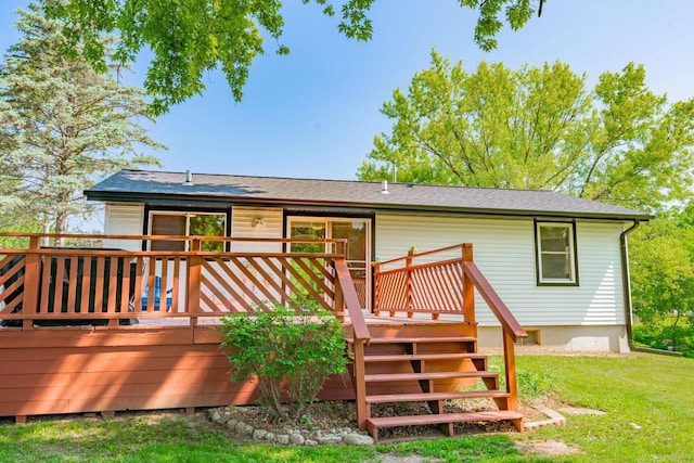 1621 W Crystal Dr, Edgerton, WI 53534 - back of property featuring a wooden deck, a lawn, stairway, and roof with shingles