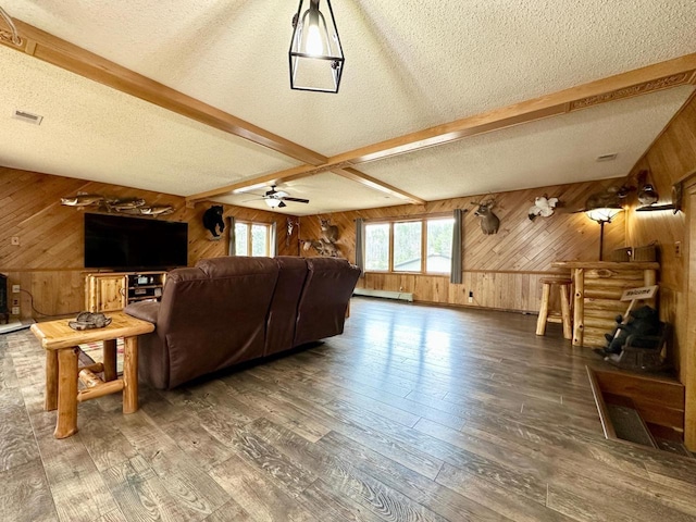 N11893 Pratt Rd, Elcho, WI 54428 - living room with wood walls, hardwood / wood-style floors, beamed ceiling, a textured ceiling, and a ceiling fan