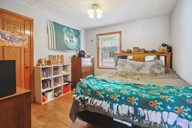 60 Madison Ave, Port Edwards, WI 54469 - bedroom with wood finished floors and a textured ceiling
