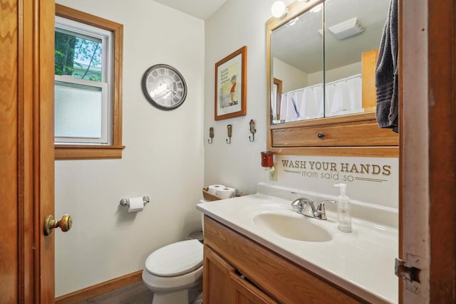 60 Madison Ave, Port Edwards, WI 54469 - bathroom with vanity, toilet, and baseboards