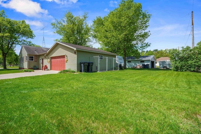 60 Madison Ave, Port Edwards, WI 54469 - view of grassy yard featuring concrete driveway and an attached garage