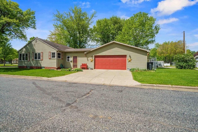 60 Madison Ave, Port Edwards, WI 54469 - ranch-style house with a garage, concrete driveway, and a front lawn