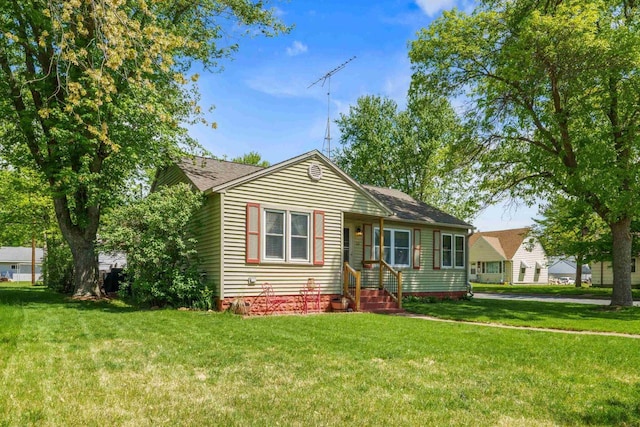 60 Madison Ave, Port Edwards, WI 54469 - view of front of house with a front lawn and roof with shingles