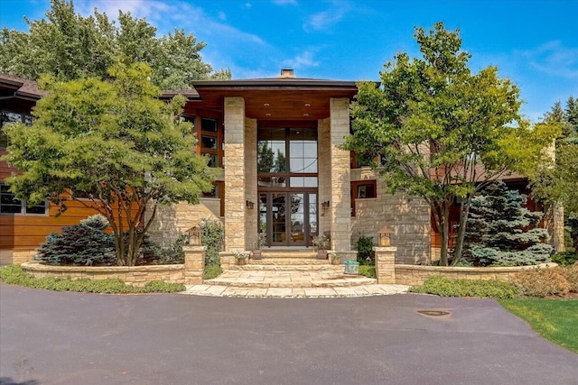 6625 Charles St, Racine, WI 53402 - doorway to property with french doors and stone siding