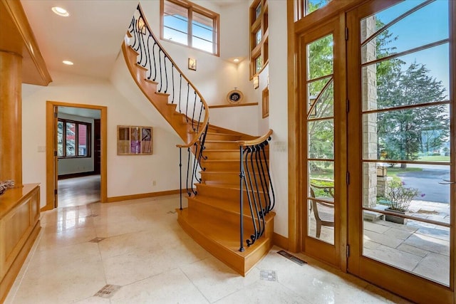 6625 Charles St, Racine, WI 53402 - foyer entrance featuring stairs, recessed lighting, baseboards, and light tile patterned floors