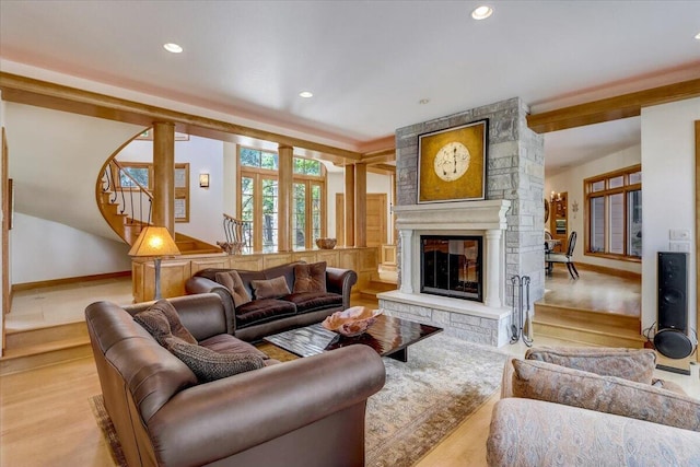 6625 Charles St, Racine, WI 53402 - living room featuring stairway, a fireplace, light wood finished floors, and recessed lighting