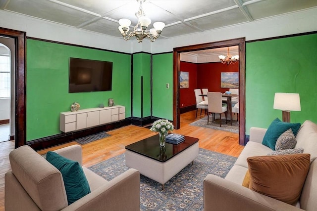 1235 Chandler St, Madison, WI 53715 - living room with a chandelier, wood finished floors, and baseboards