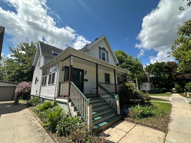 1235 Chandler St, Madison, WI 53715 - view of front of house with a porch and an outdoor structure